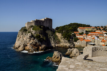 Fototapeta na wymiar Rocks, Adriatic sea and Dubrovnik old city in a beautiful sunny day.