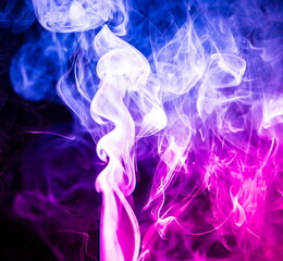 Fototapeta premium Colored smoke on black background