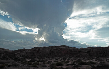 Geology. View of the sandstone and red rocky formation and mountains in the arid desert under a...