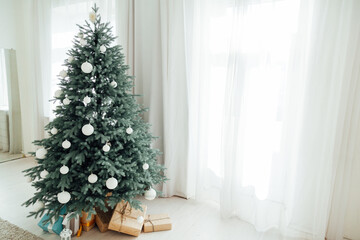 Door opening into a beautiful living room decorated for Christmas