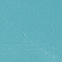A blue vintage rough sheet of carton. Recycled environmentally friendly cardboard paper texture. Simple minimalist papercraft background.