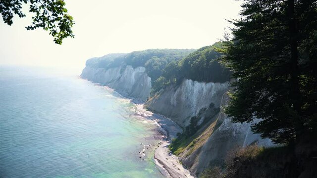 view on white chalk cliffs through forest at r&uuml;gen 