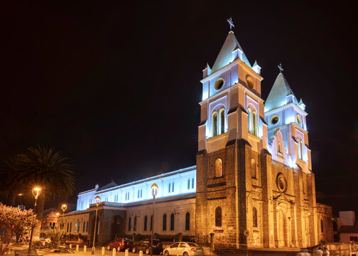 Guaranda, Bolivar province, Ecuador/ November 2013: View of the Guaranda Cathedral and central plaza, at night time.
