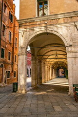 Fototapeta na wymiar View on a portico in the city of Venice, Veneto - Italy