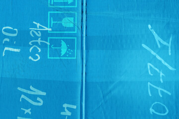 A blue vintage rough sheet of carton. Recycled environmentally friendly cardboard paper texture. Simple minimalist papercraft background.