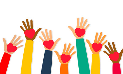 Charity, volunteering and donating concept. Raised up human hands with red hearts. Children's hands are holding heart symbols