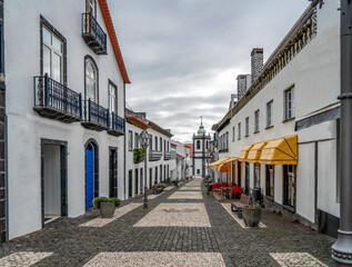 Fototapeta na wymiar Azores, Island of Sao Jorge. In the city of Velas the main shopping street in the center