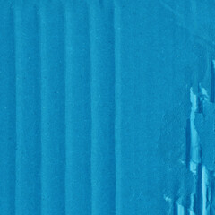A blue vintage rough sheet of carton. Recycled environmentally friendly cardboard paper texture. Simple minimalist papercraft background.