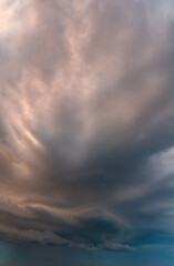 Fantastic clouds at sunrise, vertical panorama