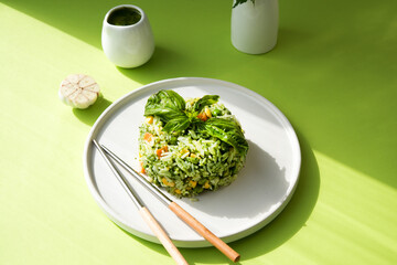 rice with vegetables and pesto sauce, creative image of an Asian dish