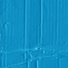 A blue vintage rough sheet of carton. Recycled environmentally friendly cardboard paper texture. Simple minimalist papercraft background.