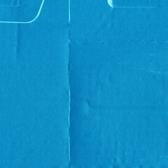 A blue vintage rough sheet of carton. Recycled environmentally friendly cardboard paper texture. Simple minimalist papercraft background.