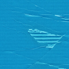 A blue vintage rough sheet of carton. Recycled environmentally friendly cardboard paper texture. Simple minimalist papercraft background.