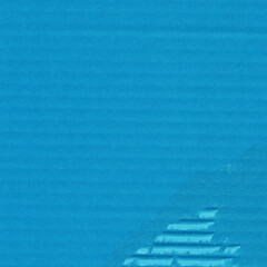 Obraz premium A blue vintage rough sheet of carton. Recycled environmentally friendly cardboard paper texture. Simple minimalist papercraft background.