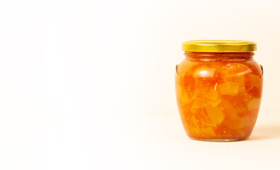 Glass jar with canned vegetables.On a white background located on the side