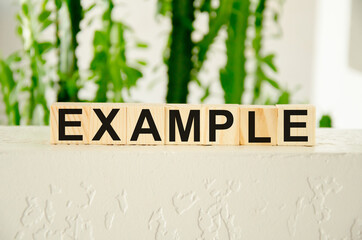 example word written on cubes and a white background from behind greens. Educational marketing or...