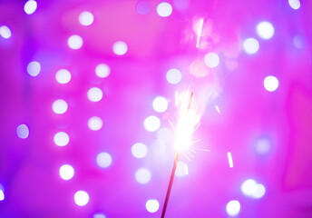 Background of festive sparklers. The concept of new year and Christmas.