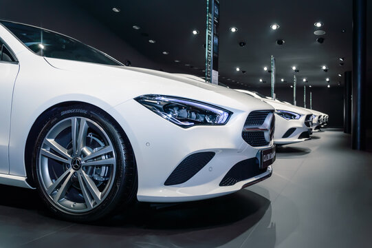 FRANKFURT - SEP 15, 2019: white car Mercedes-Benz CLA 200 Shooting Brake at IAA 2019 International Motor Show, compact luxury cars in a row. Close-up of car front, headlight and wheel