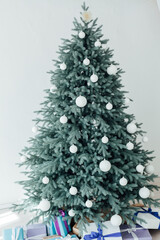 Door opening into a beautiful living room decorated for Christmas