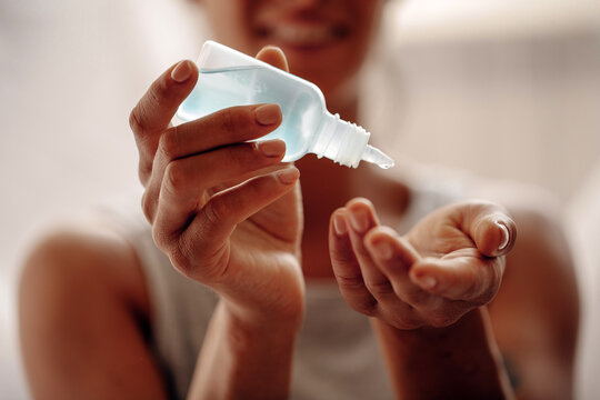 Asian elderly people wearing protective mask,using alcohol antiseptic gel,prevent infection,outbreak of Covid-19,senior woman washing hand with hand sanitizer to avoid contaminating with Coronavirus

