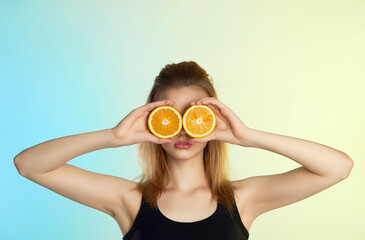 Beautiful model girl with oranges. beauty colorful portrait