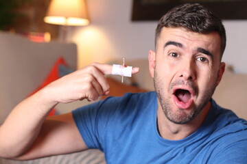 Young man suffering a domestic accident 