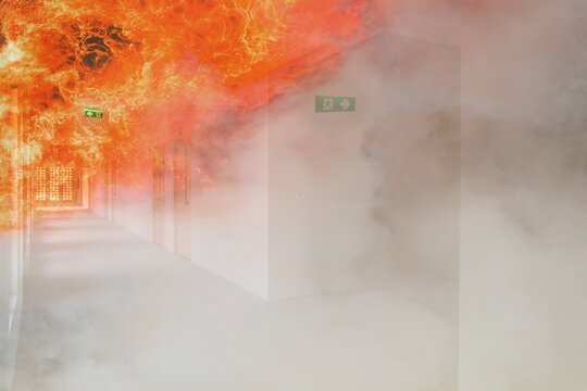 double exposure green emergency exit sign in hospital showing the way to escape with fire...............