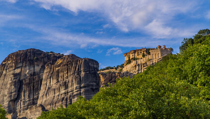 Fototapeta na wymiar Horizontal panoramic view of the Holy Monastery of Varlaam in Meteora, Thessaly, Greece built on unique rock formations