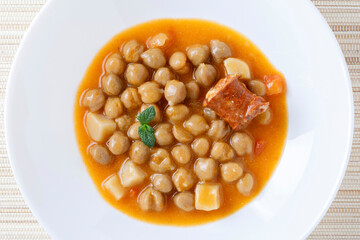 Stew with chikpeas and sausage, typical spanish