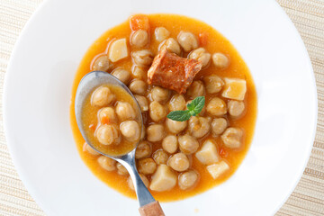Stew with chikpeas and sausage, typical spanish