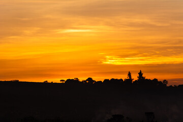 Fototapeta na wymiar Golden and magic colored sunset silhouettes, beautiful nature sunset