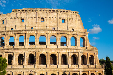 Obraz premium Close up of colloseum Rome, blue skies, golden yellow, history, momunemt, roman empire no people