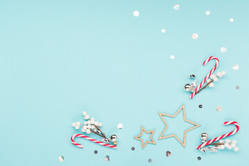 Christmas or winter holiday composition. Card with snowflakes and red gift box on pastel blue background.
