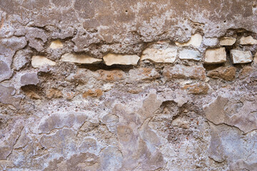humidity damaged brickwork , warm gray and sand coloured wall, backdrop, layer