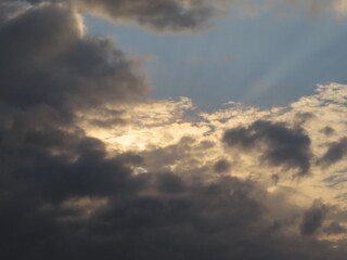 Dramatic sunlight over the dark clouds