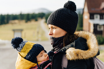 Mother with her child on a walk in Karkonosze during Autumn season.
