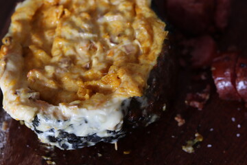 Pumpkin stuffed with cheese baked on the grill.