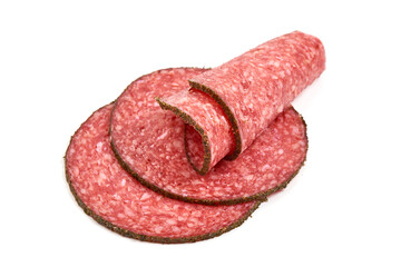 Peppered salami slices, isolated on white background