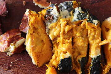 Pumpkin stuffed with cheese baked on the grill.