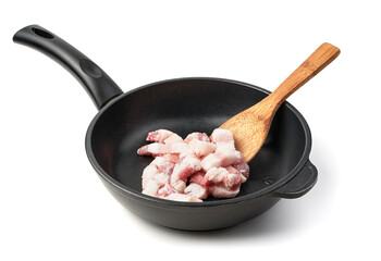 Raw meat in a frying pan on a white background. The concept of cooking.