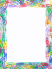 Vertical frame made of colorful paper clips on white background,top view with space for text or creativity.Frame