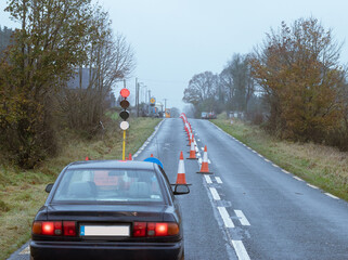 The traffic light is red, stop, road works ahead, road signs.