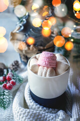Hot coffee or chocolate with marshmallows on the Christmas table. Hot winter drinks in a cozy home still life