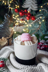 Hot chocolate with marshmallows on the Christmas table. Hot winter drinks in a cozy still life