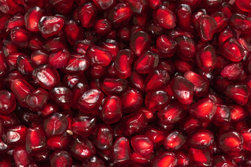 vibrant red pomgranate seeds close up shot