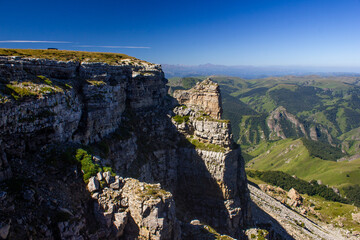 A beautiful gorge in the Caucasus Mountains. Blue sky and huge rocks. Bermamyt plateau