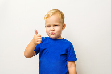 the boy shows the OK sign on a white background