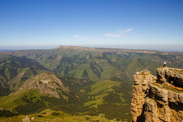 A beautiful gorge in the Caucasus Mountains. Blue sky and huge rocks. Bermamyt plateau