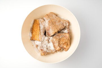 Yellow Bowl with product on a light background. The view from the top. The concept of cooking.