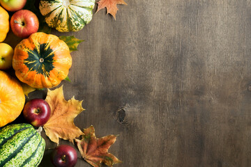 Pumpkins, apples, autumn leaves. Autumn decor. Top view.